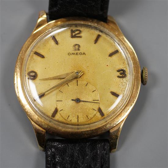 A gentlemans 1950s 18k yellow metal Omega manual wind wrist watch.